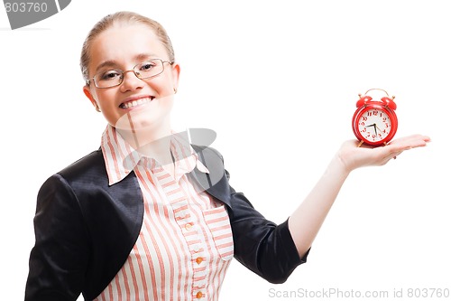 Image of Young positive woman with alarm clock
