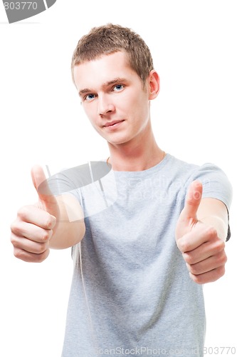 Image of Positive young man with thumbs up