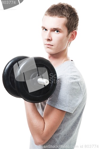 Image of Concentrated young man lift weights