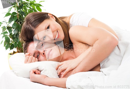 Image of Couple lay in the bed and and smile