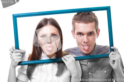 Image of Couple with stick out tongues