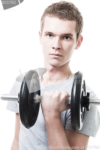 Image of Young man lift weight in gym