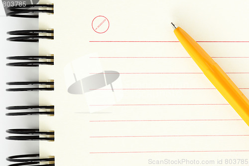 Image of Clean sheet of notebook with orange pen