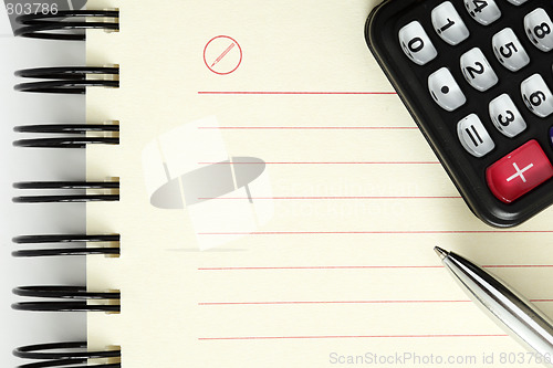 Image of Clean sheet of notebook with pen and calculator