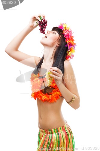 Image of Woman eat grapes wearing bikini made of flowers