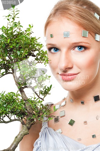 Image of Beautiful futuristic look woman with tree