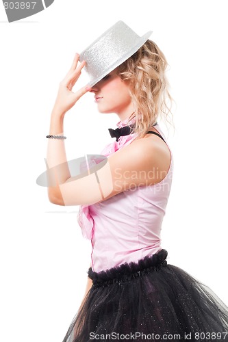 Image of Woman illusionist with magician hat