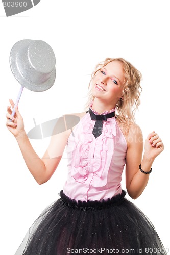 Image of Blond magitian woman play with hat and magic wand