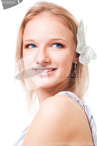 Image of Blond woman with butterfly in her hair smile