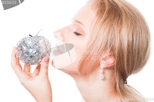 Image of Blond woman trying bible apple