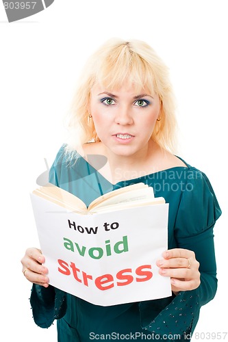 Image of Stressed woman with book