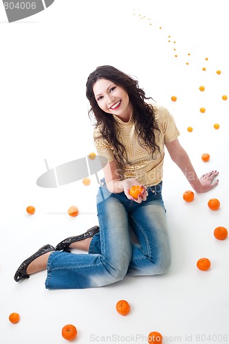 Image of tangerine fantasy  - woman sit on a road of tangerine