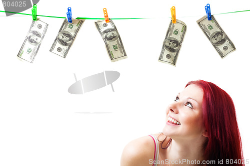 Image of Shocked woman with cash wash money