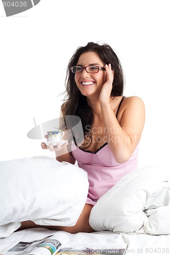 Image of Woman laughing and drink coffee