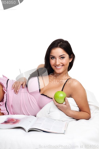 Image of Happy young woman in read bed