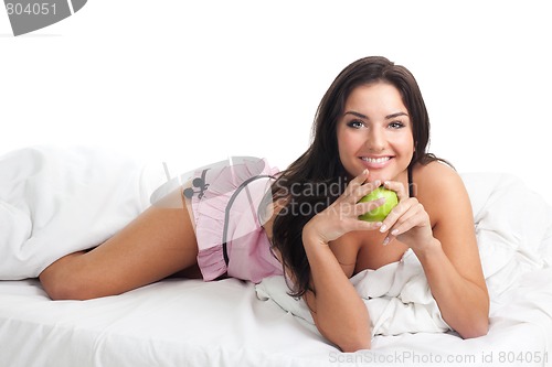 Image of Happy woman in bed smile