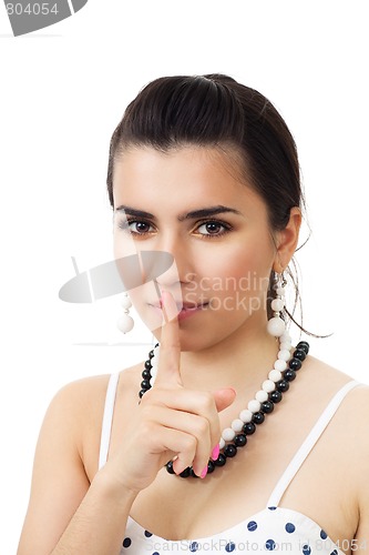 Image of Beautiful woman show hush sign