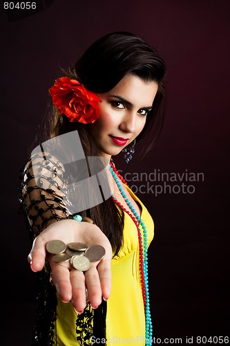 Image of gypsy woman with coins