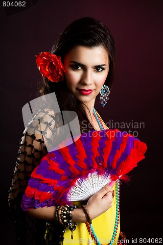 Image of Beautiful gypsy woman with fan