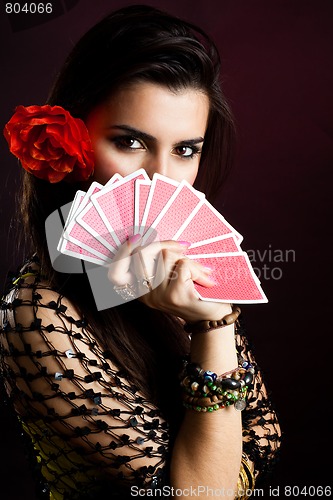 Image of Gypsy woman with fan of cards