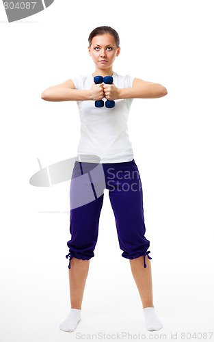 Image of Woman stand with dumbbells