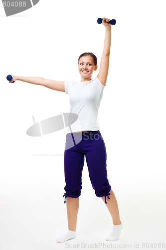Image of Happy young woman exercise with dumbbells