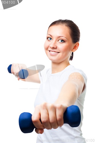 Image of Positive young woman with dumbbells