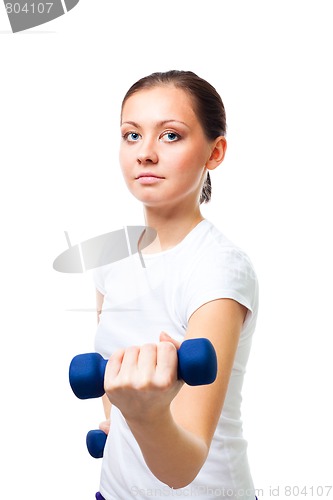 Image of Confident young woman hold dumbbells