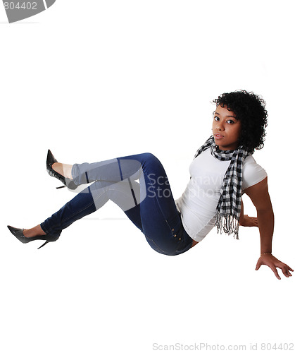 Image of Girl sitting on floor. 