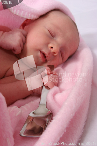 Image of Baby born with silver spoon in her mouth