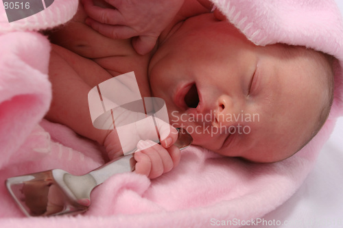 Image of Baby born with silver spoon in her mouth