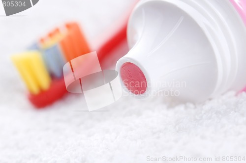 Image of toothbrush and strawberry tooth paste