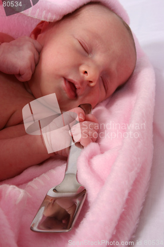 Image of Baby born with silver spoon in her mouth