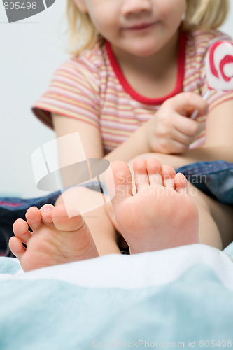 Image of Cute little barefoot girl