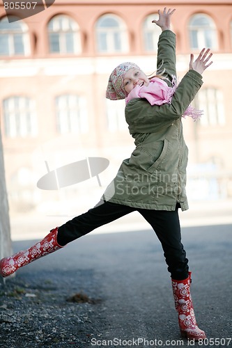Image of Beautiful teenage girl jumping outdoors