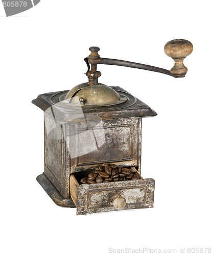 Image of Old coffee grinder with coffee beans isolated