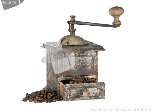 Image of Old coffee grinder with coffee beans isolated