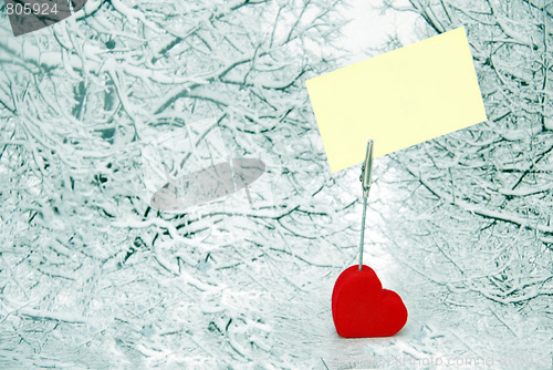 Image of Heart holder with white paper over winter background