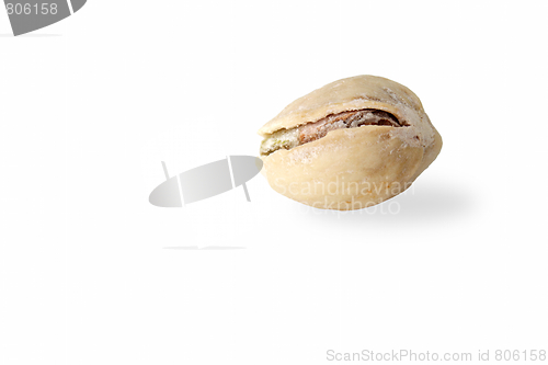 Image of Single pistachio on white background