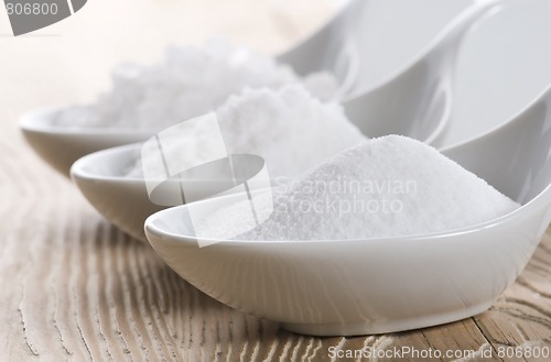 Image of three spoons with difrent salt
