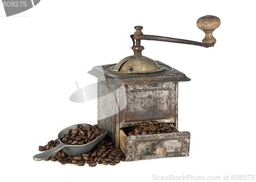 Image of Old coffee grinder with coffee beans isolated