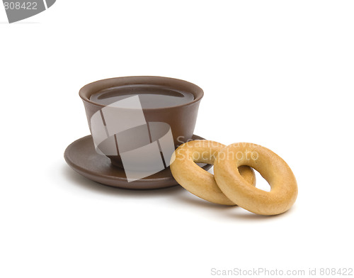 Image of The cup of tea and donuts