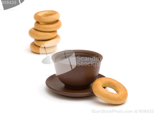 Image of The cup of tea and donuts