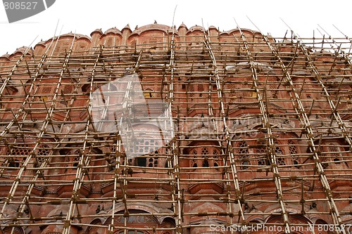 Image of Hawa Mahal (Palace Of Winds) surrounded by scaffolds in Jaipur, 