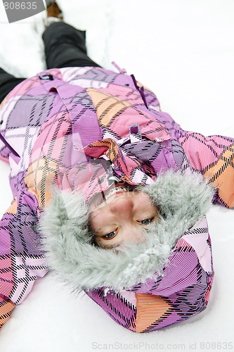 Image of Girl making snow angel