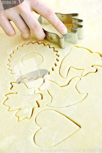 Image of Cookie cutter and dough