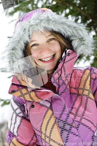 Image of Happy winter girl in ski jacket