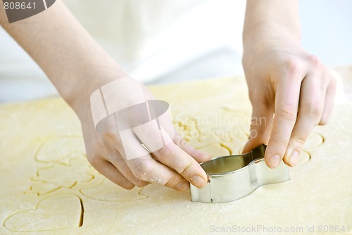 Image of Cookie cutter and dough