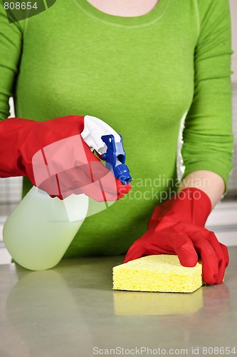 Image of Girl cleaning kitchen