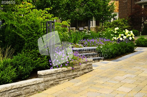 Image of Landscaped  garden and stone paved driveway